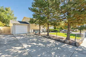 View of front of house featuring an attached garage and driveway