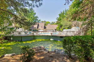 View of yard featuring a community pool and a deck