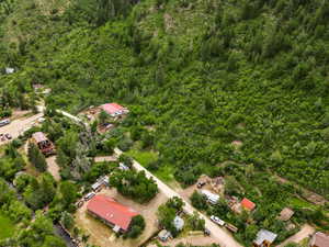 Aerial overview of property's location featuring a heavily wooded area