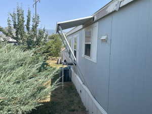 View of property exterior with a cooling unit