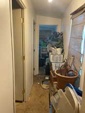 Corridor featuring crown molding