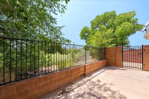 View of patio with a gate