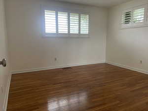 Spare room with wood finished floors