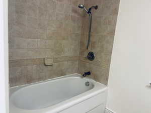 Full bathroom with shower / bath combination