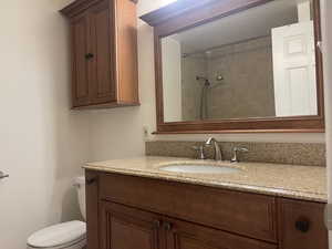 Bathroom featuring vanity and a shower