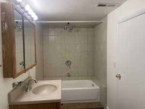 Bathroom featuring vanity and tile patterned flooring