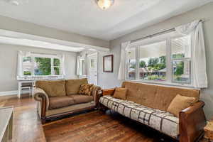 Living area featuring hardwood / wood-style floors and baseboards