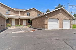 View of front of home with brick siding and driveway