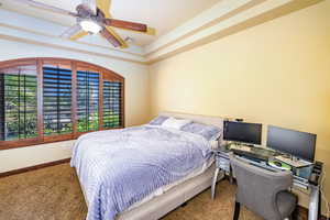 Bedroom with carpet flooring and ceiling fan
