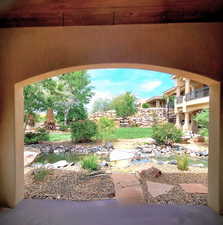 View from cabana with a water feature and garden pond