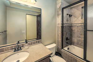 Bathroom with vanity and tiled shower / bath