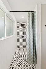 Bathroom with a tile shower