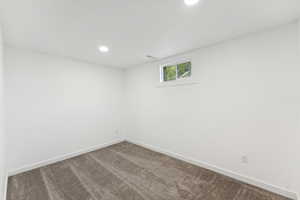 Spare room with carpet floors and recessed lighting