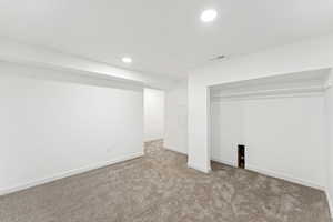 Finished basement featuring carpet flooring and recessed lighting