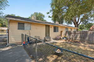 View of front of property featuring entry steps and a chimney
