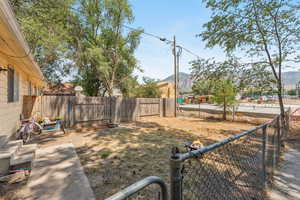 Fenced backyard with a mountain view