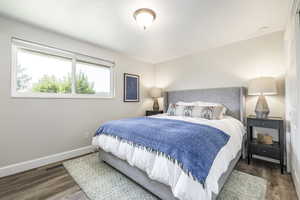 Bedroom featuring dark wood finished floors