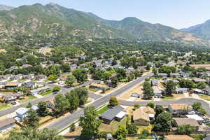 Aerial view of residential area featuring a mountain backdrop