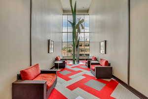 Lobby with expansive windows and a towering ceiling