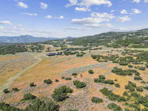 View of mountain backdrop featuring rural landscape