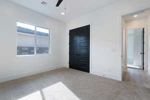 Unfurnished bedroom with carpet floors, recessed lighting, a closet, and a ceiling fan