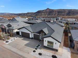 Aerial perspective of suburban area featuring a mountain backdrop