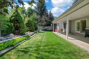 View of yard with a patio area