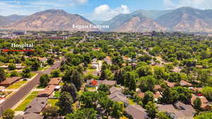 Aerial perspective of suburban area with a mountainous background
