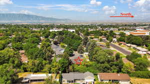 Aerial perspective of suburban area with a mountainous background