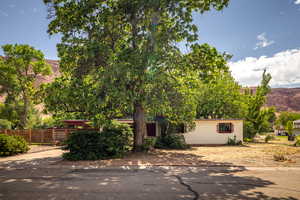 View of front from street with Moab Rim view