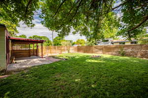 Fenced backyard featuring a patio area