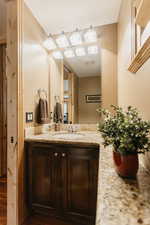 Bathroom featuring vanity and wood finished floors