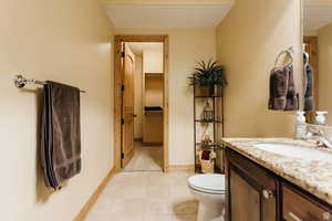 Bathroom with vanity and tile patterned floors