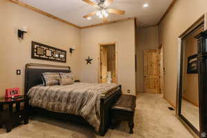 Bedroom featuring light carpet, crown molding, recessed lighting, and ceiling fan