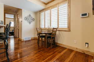 Dining room with wood finished floors and baseboards
