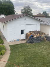 View of side of property featuring a lawn