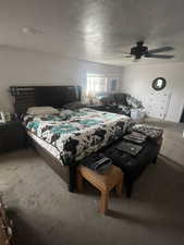 Bedroom featuring carpet floors and ceiling fan