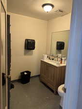 Bathroom with vanity and toilet