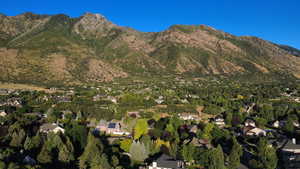 View of mountain backdrop with nearby suburban area