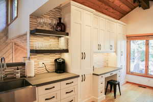 Office area featuring vaulted ceiling, wood ceiling, light wood-style floors, and track lighting