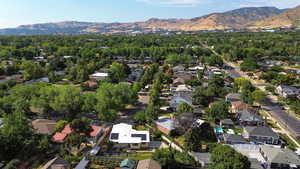 View of property location featuring nearby suburban area and mountains