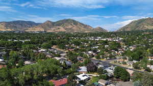 Aerial view of property's location with a mountainous background