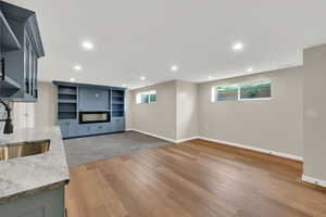 Unfurnished living room with light wood finished floors and recessed lighting