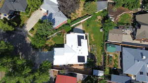Aerial view of property's location with nearby suburban area