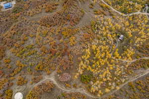 Aerial view of property and surrounding area with a desert landscape