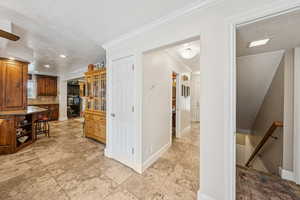 View of kitchen area, Hallway and stairs to Lower Level