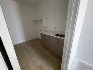 Washroom with light wood finished floors and baseboards