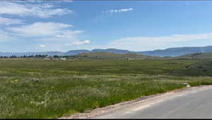 View of mountain backdrop featuring rural landscape