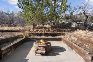 View of patio / terrace featuring an outdoor fire pit