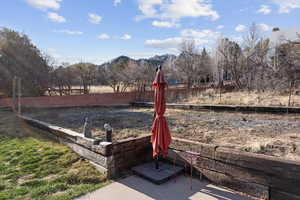 Fenced backyard with a mountain view